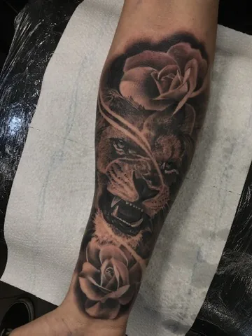 Lion with roses — black & grey tattoo by Alex Roze, Kelowna