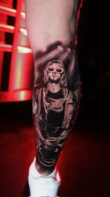Kurt Cobain, Nirvana portrait leg — black & grey tattoo by Alex Roze, Kelowna
