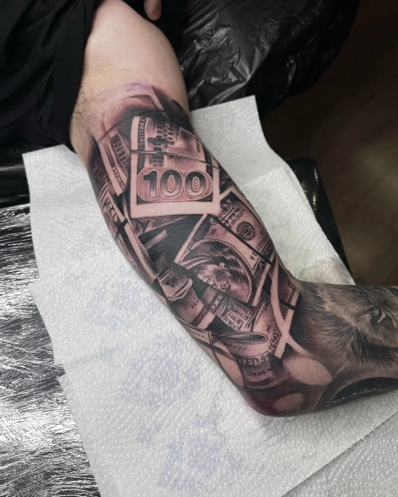 Hundred dollar bills and wolf money sleeve — black & grey tattoo by Alex Roze, Kelowna
