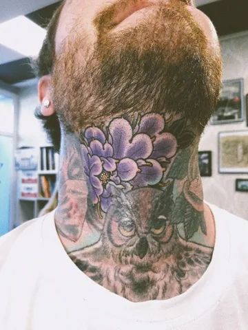 Owl and purple blossom on the neck — neo-traditional tattoo by Alex Roze, Kelowna