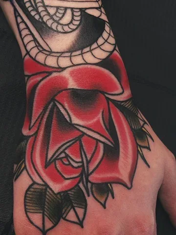 Red rose with spiderweb on the hand — neo-traditional tattoo by Alex Roze, Kelowna