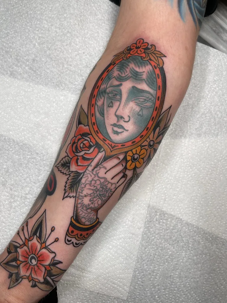 Lady crying into a hand mirror — traditional tattoo by Alex Roze, Kelowna