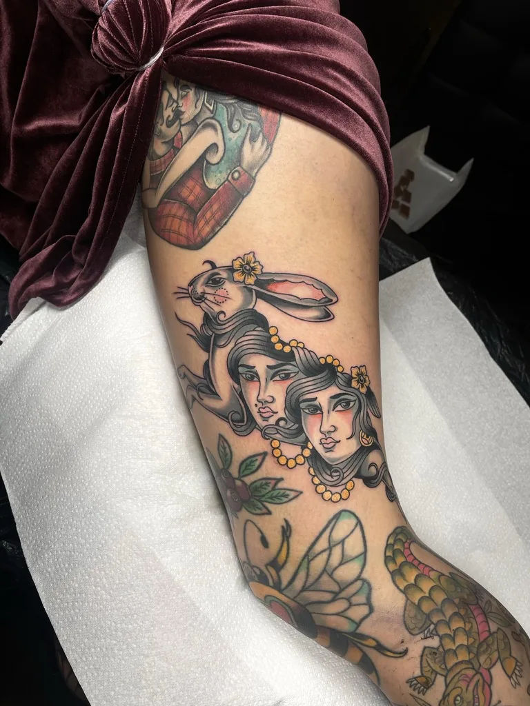 Two women with a rabbit and flowers — traditional tattoo by Alex Roze, Kelowna