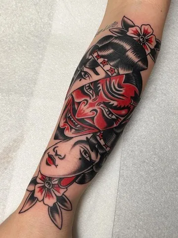 Two women with a red heart mask — traditional tattoo by Alex Roze, Kelowna