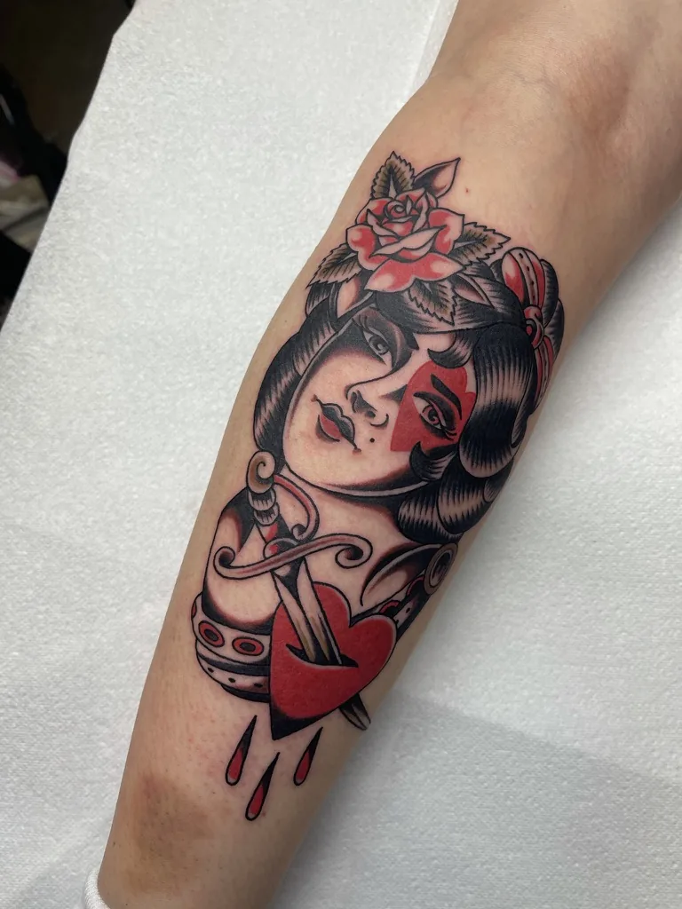 Woman with rose, heart and dagger — traditional tattoo by Alex Roze, Kelowna