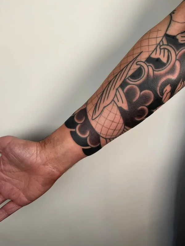 Blackwork Japanese cloud and geometric sleeve detail. Tattoo by Alex Roze.