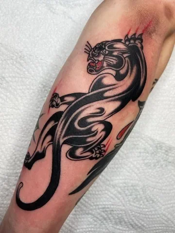 Panther face, blackwork. Tattoo by Alex Roze.