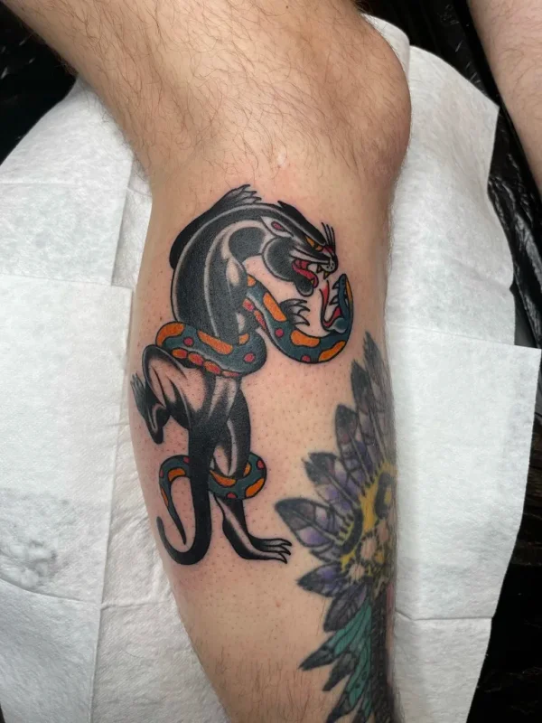 Black panther fighting a snake. Tattoo by Alex Roze.