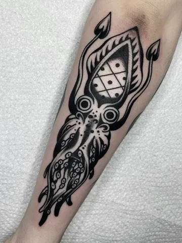Blackwork squid with dice. Tattoo by Alex Roze.