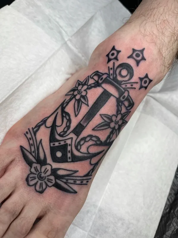 Anchor with flowers. Tattoo by Alex Roze.